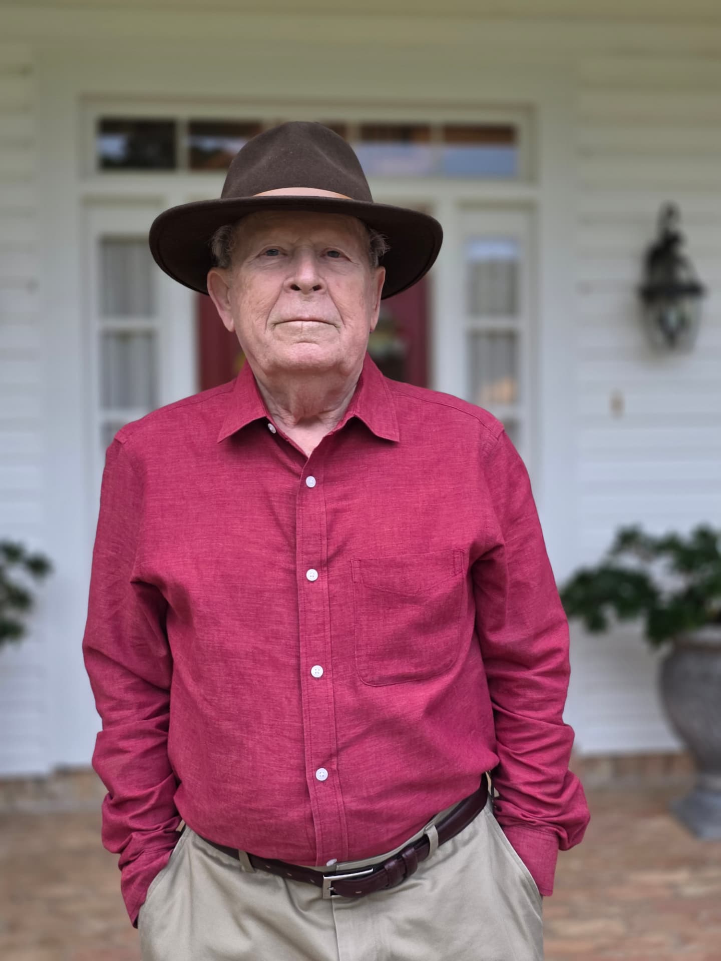Dr. Robert “Bob” Flournoy standing on the front porch of his Louisiana home